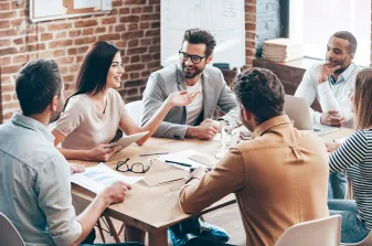 A team meeting around a wooden table