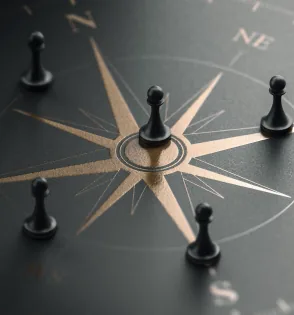 Chess pieces around a compass rose