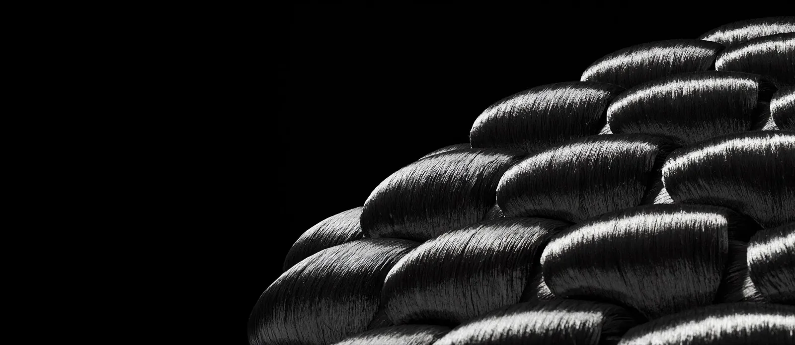 Close-up of woven carbon fiber strands